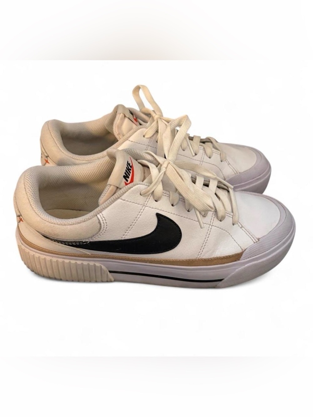 Nike Women’s Athletic Sneakers in Cream with Black Swoosh